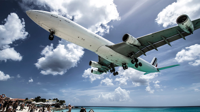 airplane about to land on a runway